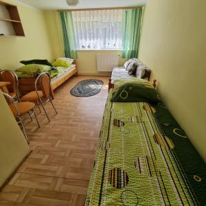 Postel nebo postele na pokoji v ubytování Kryniczanka