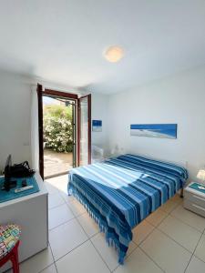 Cama o camas de una habitación en Il Borgo dei Mirti