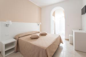 Кровать или кровати в номере Hotel Falcone