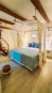 En eller flere senge i et værelse på Pousada Lua de Charme