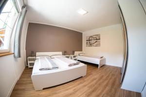 Flow Apartments Margareta tesisinde bir odada yatak veya yataklar