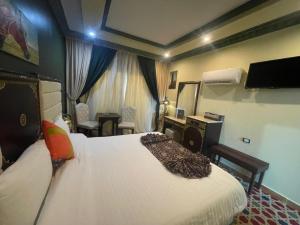 Postel nebo postele na pokoji v ubytování Omar Elkhaiam Hotel