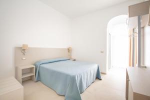 Кровать или кровати в номере Hotel Falcone