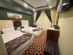 Postel nebo postele na pokoji v ubytování Omar Elkhaiam Hotel