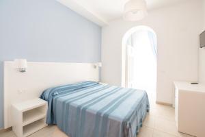 Кровать или кровати в номере Hotel Falcone