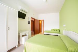 Кровать или кровати в номере Hotel Falcone