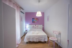 Postel nebo postele na pokoji v ubytování EXCLUSIVE ROOMS Al Vicoletto