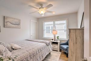 a bedroom with a bed and a ceiling fan at Port Clinton Home with Lake Views! in Port Clinton