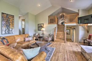a living room with a couch and a staircase at On-Site Hiking Access Mtn-View Conifer Cabin in Conifer