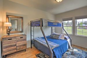 a bedroom with bunk beds and a dresser and a mirror at On-Site Hiking Access Mtn-View Conifer Cabin in Conifer