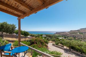 a view of the ocean from the balcony of a house at Anthia Apartment Sea View in Kato Zakros