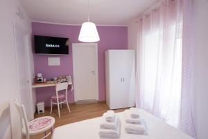 Postel nebo postele na pokoji v ubytování EXCLUSIVE ROOMS Al Vicoletto