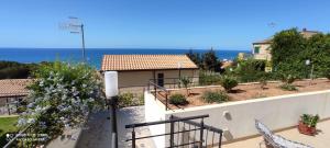 a balcony of a house with a view of the ocean at Lucia's Garden in Cefalù