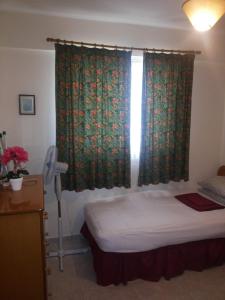 Postel nebo postele na pokoji v ubytování Apartments Mackenzie 1+1
