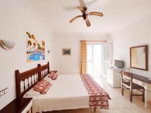 Postel nebo postele na pokoji v ubytování Villa Columbus Family Boutique Hotel + 37 fotografií
