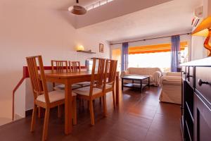 a kitchen and dining room with a table and chairs at Clipper 309 in La Manga del Mar Menor