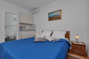 Un pat sau paturi într-o cameră la Pension Dijakovic