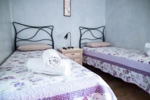 En eller flere senge i et værelse på Il Riparo
