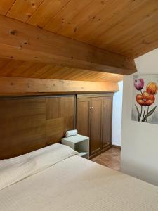 Postel nebo postele na pokoji v ubytování La Brezza del Pollino