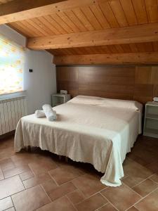 Postel nebo postele na pokoji v ubytování La Brezza del Pollino