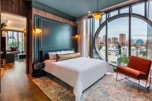 Postel nebo postele na pokoji v ubytování Hotel Marquee Medellín