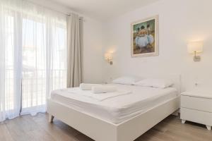 Voodi või voodid majutusasutuse Apartments Anna Liznjan toas
