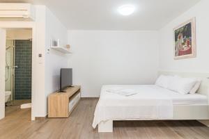 Voodi või voodid majutusasutuse Apartments Anna Liznjan toas