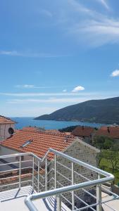 a view of the ocean from the balcony of a house at Apartment Jovana in Igalo