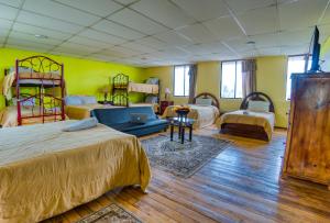a hotel room with two beds and a laptop in it at Hotel Royalty in Riobamba +33 photos