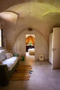 a room with a bed and a room with two beds at Antica Casina B&B di Charme in Pulsano