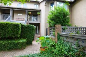 a garden in front of a house at Bohicket Marina Condo in Seabrook Island