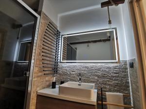 a bathroom with a sink and a mirror at Loft Porta Sud in Brindisi