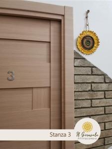 a picture of a garage door with a sunburst wreath at IL GIRASOLE in Porto Torres