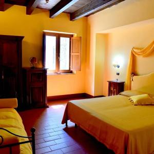 A bed or beds in a room at Il Castello dei Principi Sanseverino