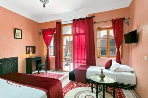 Postel nebo postele na pokoji v ubytování Arabian Riad Marrakech