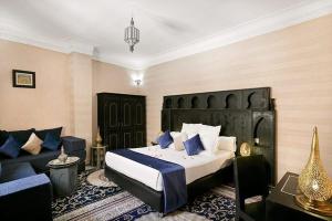 Postel nebo postele na pokoji v ubytování Arabian Riad Marrakech