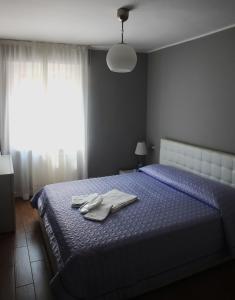Postel nebo postele na pokoji v ubytování Casa Jomi b&b Borghetto Lodigiano
