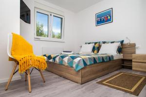 Postel nebo postele na pokoji v ubytování Apartments Jedro