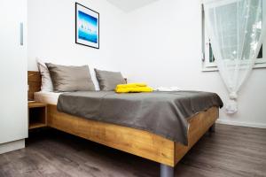 Postel nebo postele na pokoji v ubytování Apartments Jedro
