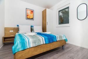 Postel nebo postele na pokoji v ubytování Apartments Jedro