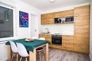 Kuchyň nebo kuchyňský kout v ubytování Apartments Jedro