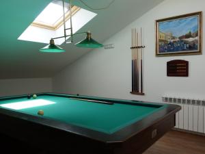 a pool table in a room with a ceiling at Casa Rural Maruja 