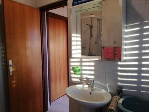 a bathroom with a sink and a mirror at Apartment Stella in Vodnjan +11 photos