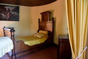 A bed or beds in a room at Il Castello dei Principi Sanseverino