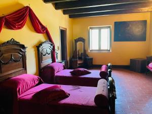 A bed or beds in a room at Il Castello dei Principi Sanseverino