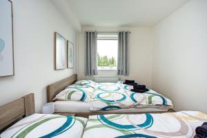 Postel nebo postele na pokoji v ubytování Green apartment Klínovec