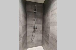 a shower stall with a toilet in a bathroom at KITESURF - 100M PLAGE - DECO DESIGN in Berck-sur-Mer +19 photos