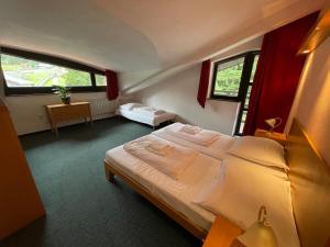 Voodi või voodid majutusasutuse Hotel Bohemia toas