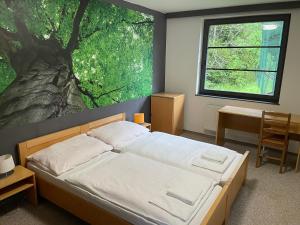 Voodi või voodid majutusasutuse Hotel Bohemia toas