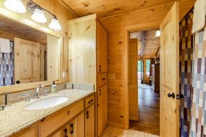 a bathroom with a sink and a mirror at Aska Woodlands in Aska +30 photos